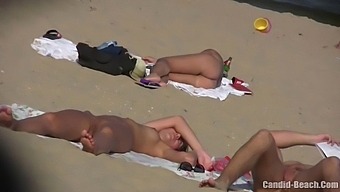 Amateur Lovers Indulge In Nudism On The Beach In Hidden Camera Video